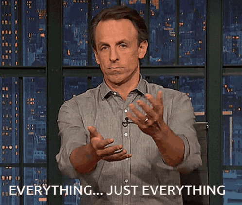 a man is making a gesture with his hands and says everything just everything