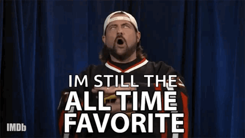 A Man Is Making A Gesture With His Hands And Says Im Still The All Time Favorite . GIF