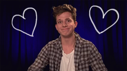 A Man Is Making A Heart Shape With His Hands GIF