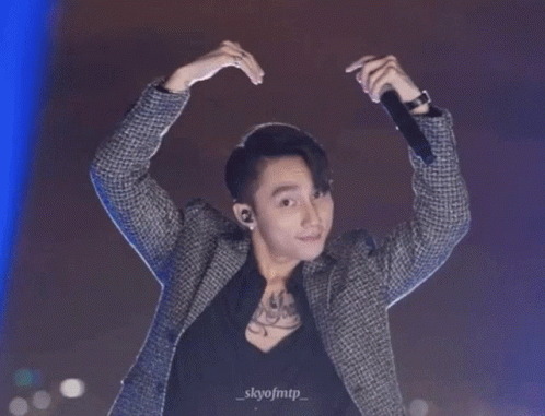 A Man Is Making A Heart Shape With His Hands And The Name Skyofmtp Is On The Bottom Right GIF