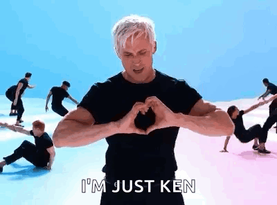 A Man Is Making A Heart Shape With His Hands In A Video . GIF