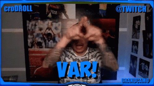 a man is making a heart with his hands and the word var is on the screen