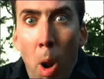A Man Is Making A Surprised Face With His Mouth Open GIF