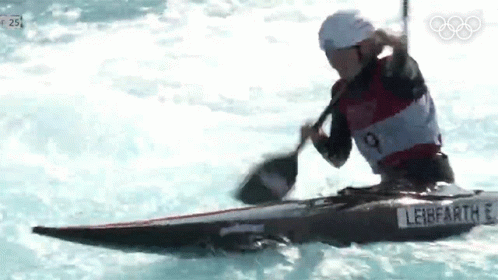 A Man Is Paddling A Kayak In The Water With A Paddle And A Sticker That Says Leibfartl GIF