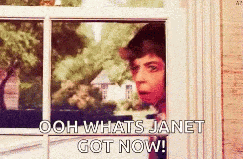 A Man Is Peeking Out Of A Window And Saying `` Ooh Whats Janet Got Now '' . GIF