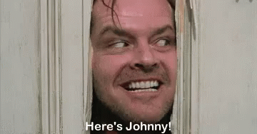 A Man Is Peeking Through A Door And Saying `` Here 'S Johnny ! '' GIF
