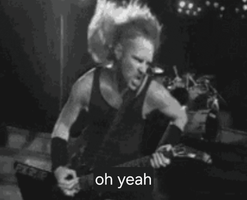 A Man Is Playing A Guitar In A Black And White Photo And Says `` Oh Yeah '' . GIF