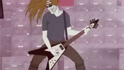A Man Is Playing A Guitar In Front Of A Wall Of Speakers . GIF