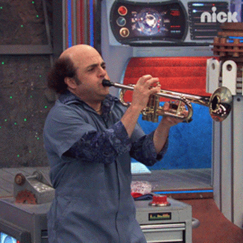 A Man Is Playing A Trumpet In Front Of A Nick Logo GIF