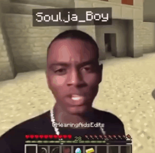 A Man Is Playing A Video Game With The Name Soulja Boy On His Head . GIF