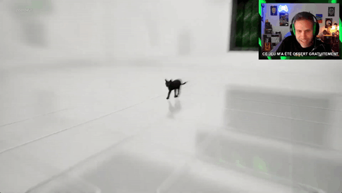 A Man Is Playing A Video Game With The Words Zooming Behind Him GIF