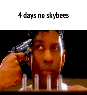 A Man Is Pointing A Gun At His Head With The Words `` 4 Days No Skybees '' . GIF