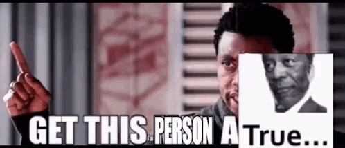 A Man Is Pointing At A Picture Of A Man And Saying `` Get This Person A True ... '' . GIF