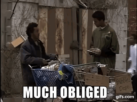 A Man Is Pushing A Shopping Cart With A Sign That Says `` Much Obliged '' Next To Him . GIF