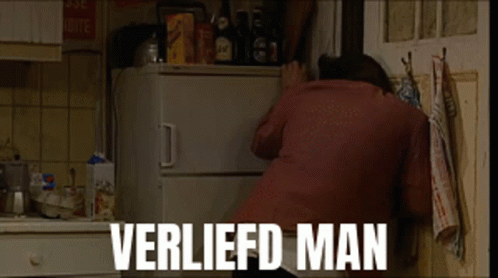A Man Is Reaching Into A Refrigerator With The Words Verliefd Man Written On The Bottom GIF