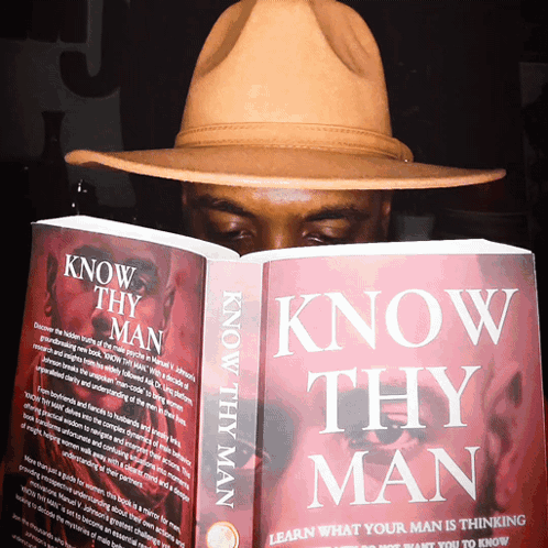 A Man Is Reading A Book Called Know Thy Man GIF