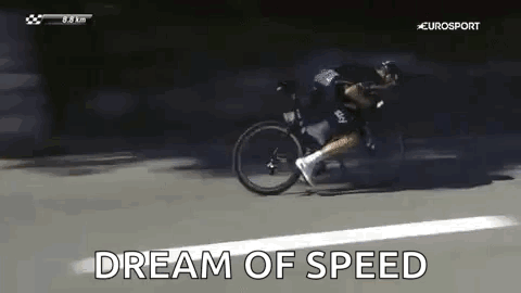 A Man Is Riding A Bicycle Down A Road And The Words `` Dream Of Speed '' Are Being Displayed . GIF