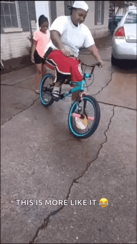 A Man Is Riding A Bike With A Little Girl On The Back And The Caption " This Is More Like It " GIF