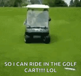 A Man Is Riding A Golf Cart On A Golf Course With A Golf Bag On The Back . GIF