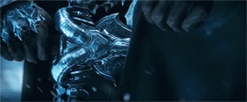 A Man Is Riding A Horse With A Sword In His Hand In The Snow . GIF