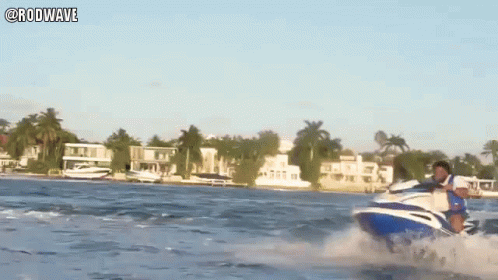 A Man Is Riding A Jet Ski In The Ocean With The Hashtag Rodwave GIF