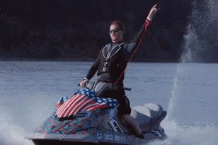 A Man Is Riding A Jet Ski With A License Plate That Says Cf 3812 Rn975 GIF