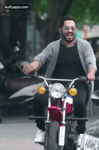 Man Riding Motorcycle Wearing Sunglasses GIF