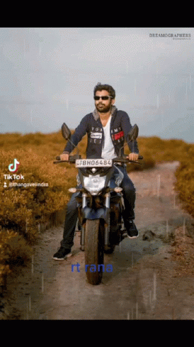 A Man Is Riding A Motorcycle With A License Plate That Says Bh06488 GIF