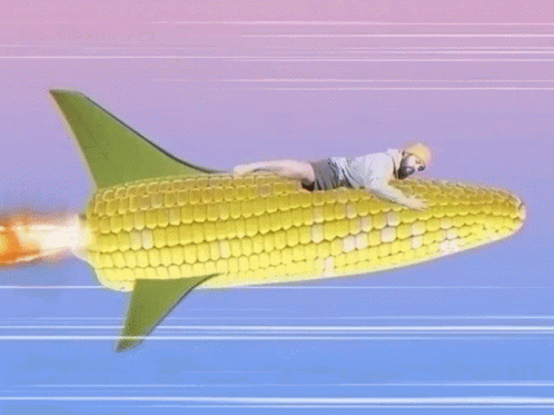 A Man Is Riding A Rocket Made Out Of Corn On The Cob . GIF