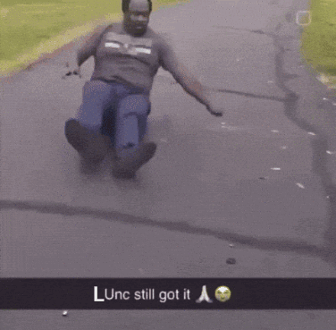 A Man Is Riding A Scooter Down A Road With The Caption Lunc Still Got It GIF