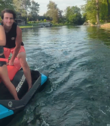 A Man Is Riding A Sea Doo Jet Ski In The Water GIF