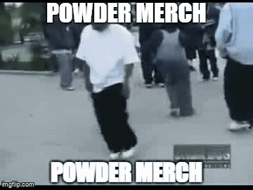 A Man Is Riding A Skateboard Down A Street With A Crowd Behind Him . GIF