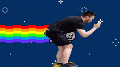 A Man Is Riding A Skateboard In Front Of A Pixelated Cat With A Rainbow Coming Out Of Its Tail GIF