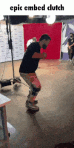 A Man Is Riding A Skateboard In Front Of A Red Backdrop With The Caption Epic Embedded Clutch GIF