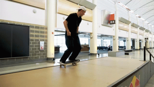 A Man Is Riding A Skateboard On A Ramp With A Sign That Says D4 On It GIF