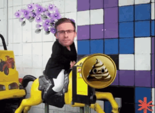 A Man Is Riding A Yellow Horse With A Can Of Poop In The Back GIF