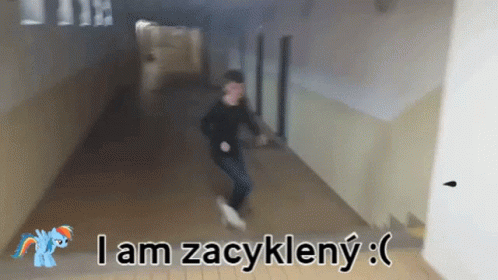 A Man Is Running Down A Hallway With The Words I Am Zacykleny Written On The Bottom GIF