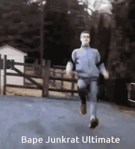 A Man Is Running Down A Road With The Words Bape Junkrat Ultimate On The Bottom GIF