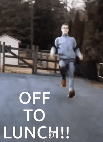 A Man Is Running Down A Road With The Words Off To Lunch GIF