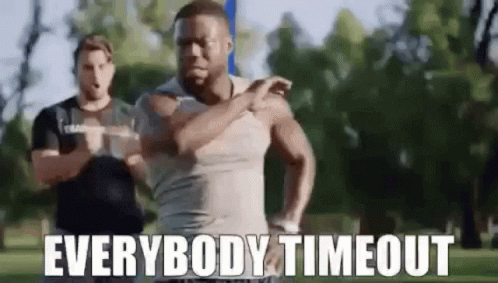 A Man Is Running In A Park With The Words `` Everybody Timeout '' Written On It . GIF