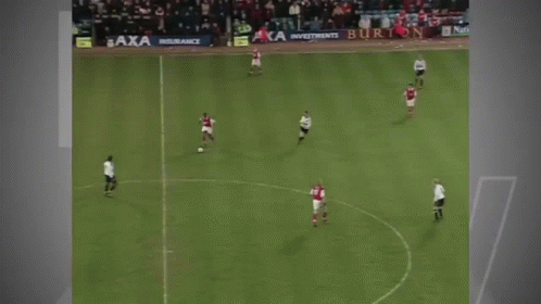 A Man Is Running On A Soccer Field In Front Of A Banner That Says Citizen GIF