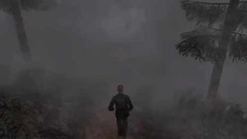 A Man Is Running Through A Foggy Forest With Trees . GIF