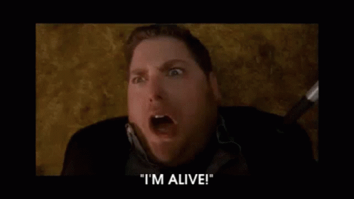 A Man Is Screaming And Saying `` I 'M Alive '' In A Movie . GIF