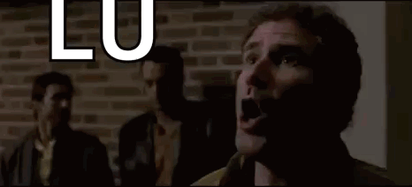 A Man Is Screaming In Front Of A Brick Wall With The Words `` Flu , You 'Re My Boy '' . GIF