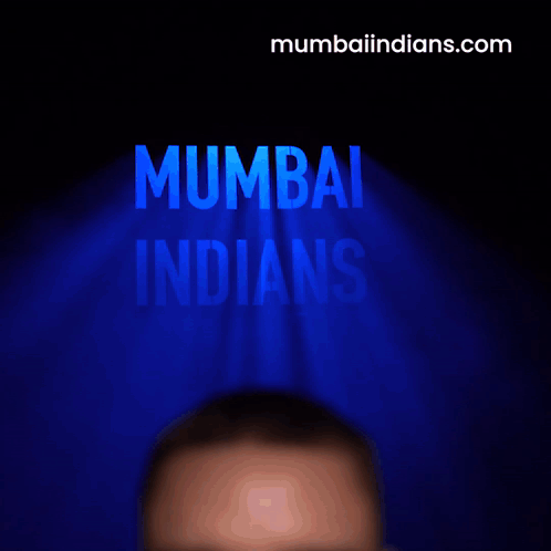 A Man Is Screaming In Front Of A Mumbai Indians Logo GIF