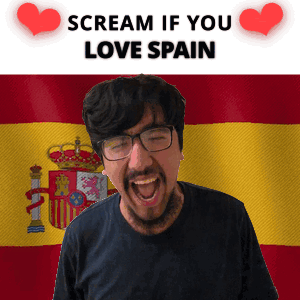 A Man Is Screaming In Front Of A Spanish Flag GIF