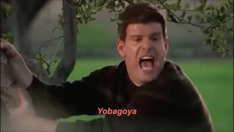 A Man Is Screaming In Front Of A Tree And The Word Yobagoya Is On The Bottom Of His Face . GIF
