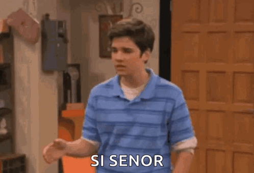 A Man Is Screaming With His Arms In The Air And The Words `` Si Senor '' Written On The Screen . GIF