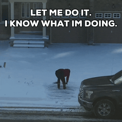 A Man Is Shoveling Snow In Front Of A House With The Words " Let Me Do It I Know What Im Doing " GIF