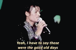 a man is singing into a microphone and saying yeah i have to say those were the good old days .